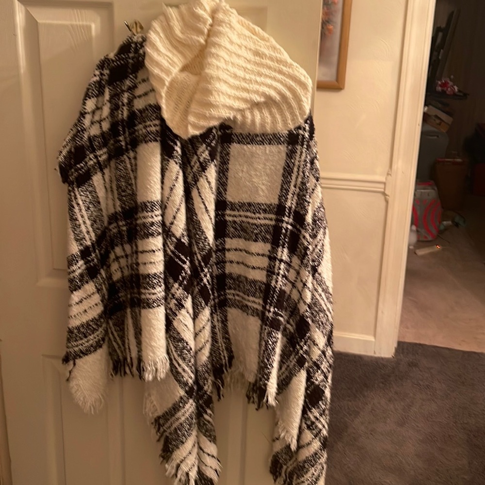 This is a black and white wool shaw